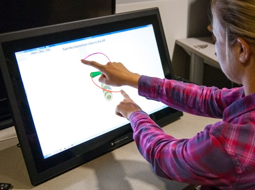 The gesture collection apparatus and a user performing a two handed gesture.
